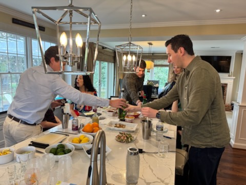 Guests being served at an indoor wedding reception bar